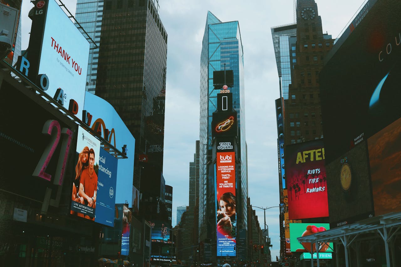 about-03 Bustling Times Square with bright billboards and towering skyscrapers in New York City.