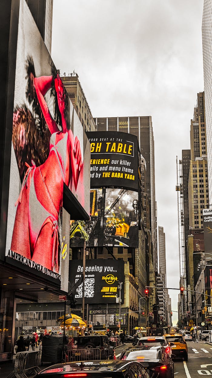 Bustling view of Times Square's vibrant billboards and busy street in New York City.